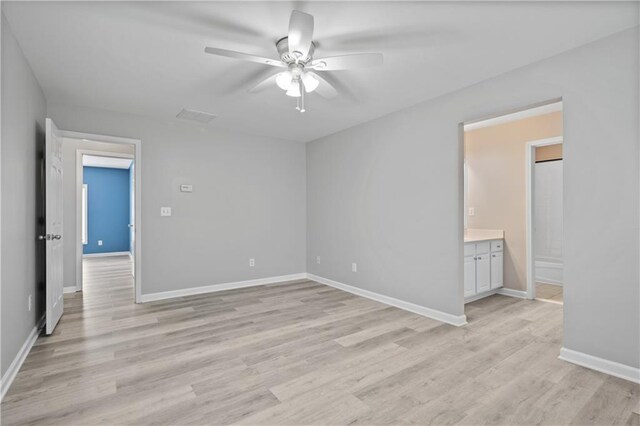 2595 Glaramara Ter, Cumming, GA 30041 - empty room with ceiling fan, light wood-style floors, and baseboards