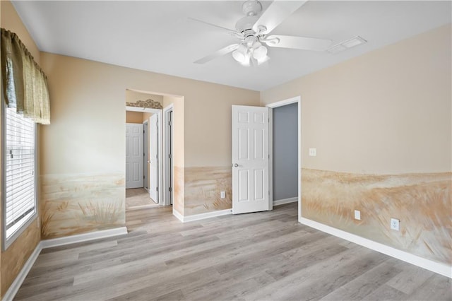 2595 Glaramara Ter, Cumming, GA 30041 - unfurnished bedroom featuring wood finished floors, baseboards, and a ceiling fan