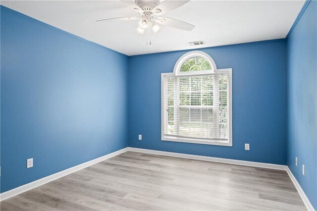2595 Glaramara Ter, Cumming, GA 30041 - empty room featuring wood finished floors, a ceiling fan, and baseboards