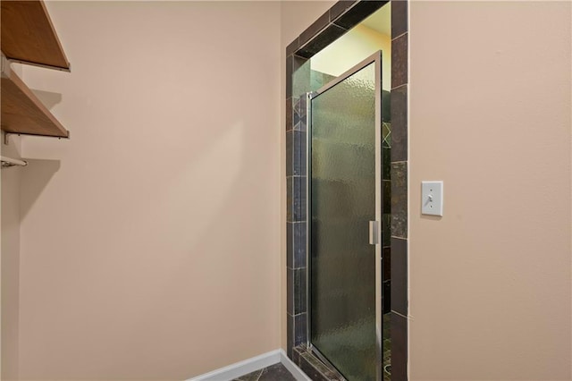 2595 Glaramara Ter, Cumming, GA 30041 - bathroom featuring a stall shower and baseboards