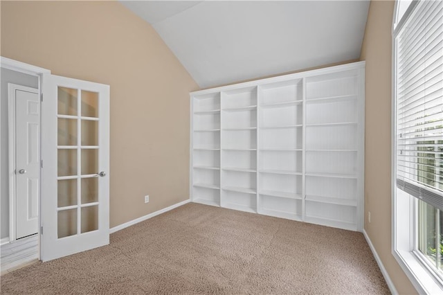 2595 Glaramara Ter, Cumming, GA 30041 - carpeted spare room featuring vaulted ceiling, healthy amount of natural light, and baseboards