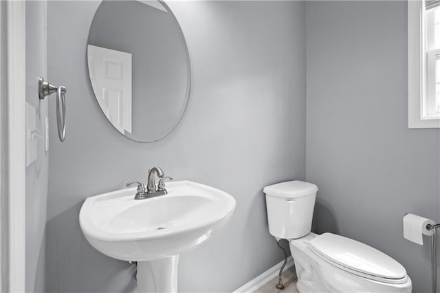 2595 Glaramara Ter, Cumming, GA 30041 - half bath featuring toilet, a sink, and baseboards
