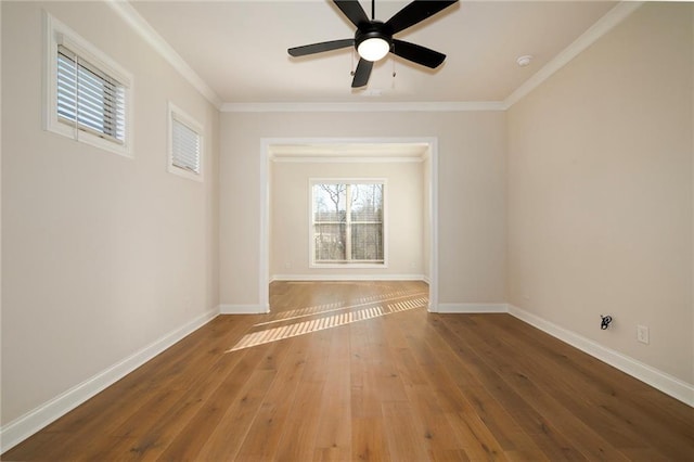 unfurnished room with ceiling fan, crown molding, and hardwood / wood-style flooring