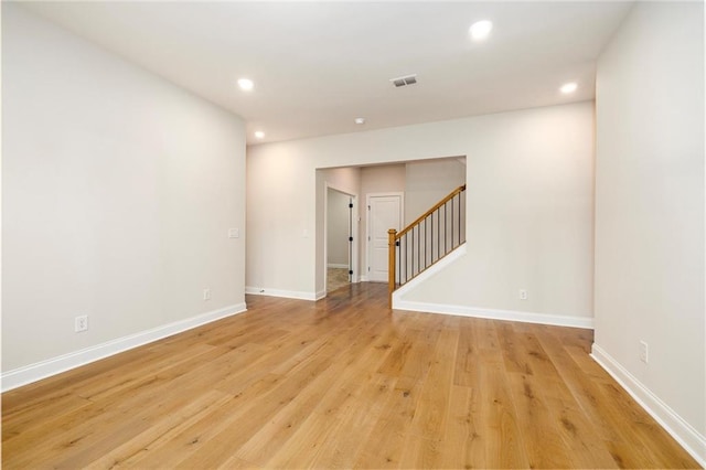 spare room with light hardwood / wood-style floors