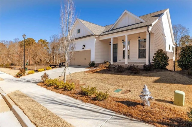 view of front of house with covered porch and a garage