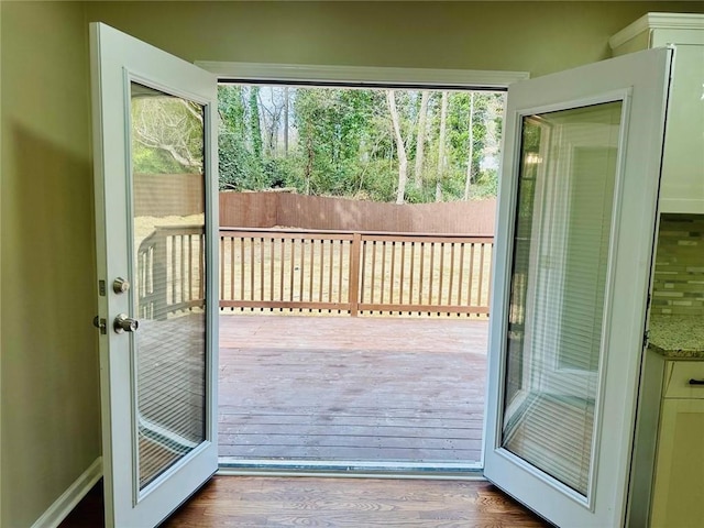 doorway with wood finished floors