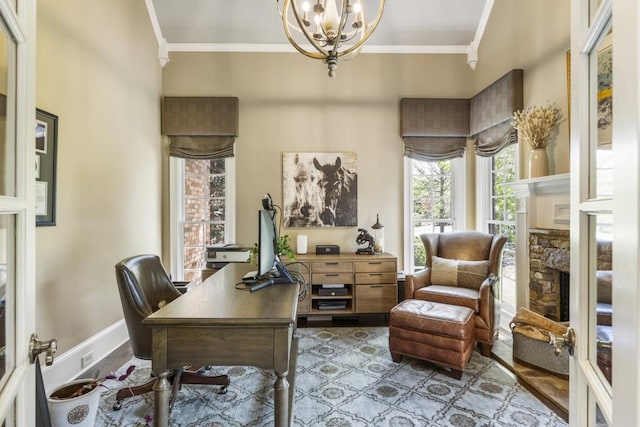office space with a notable chandelier, a wealth of natural light, and ornamental molding
