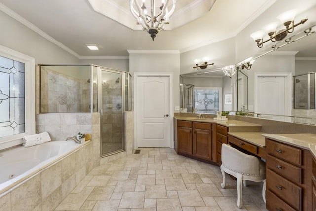 full bath featuring a stall shower, a notable chandelier, a whirlpool tub, vanity, and ornamental molding