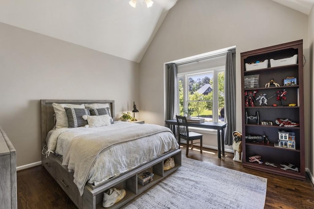 bedroom with high vaulted ceiling, baseboards, and dark wood-style floors