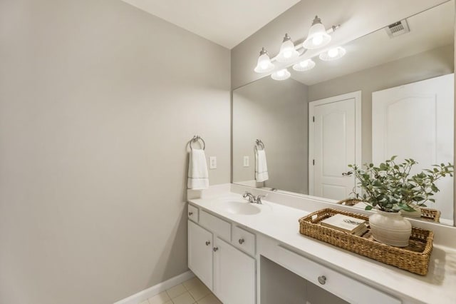 bathroom with baseboards, visible vents, vanity, and tile patterned floors