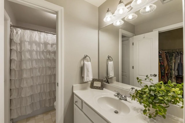 full bath with toilet, tile patterned floors, vanity, and a shower with shower curtain