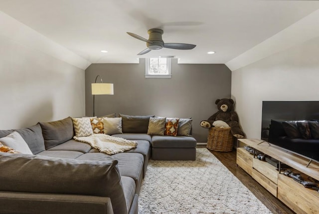 living area featuring dark wood-type flooring, lofted ceiling, ceiling fan, and recessed lighting