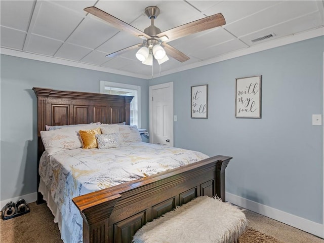 carpeted bedroom with ceiling fan, visible vents, and baseboards