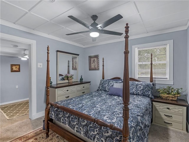 bedroom with ornamental molding, a drop ceiling, ceiling fan, and baseboards