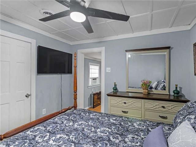 bedroom featuring baseboards, cooling unit, visible vents, and a ceiling fan