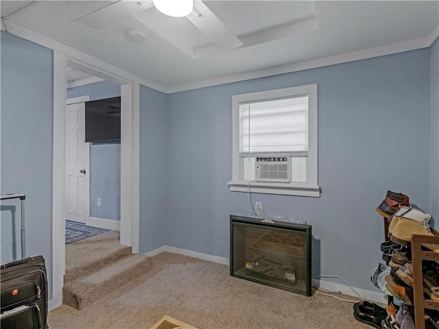 interior space with light carpet, baseboards, and cooling unit