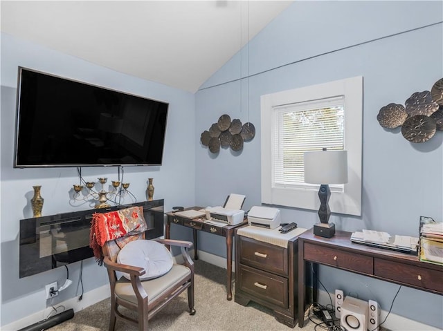 office featuring lofted ceiling and light carpet