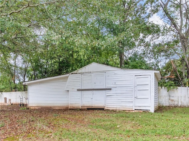 view of shed with fence