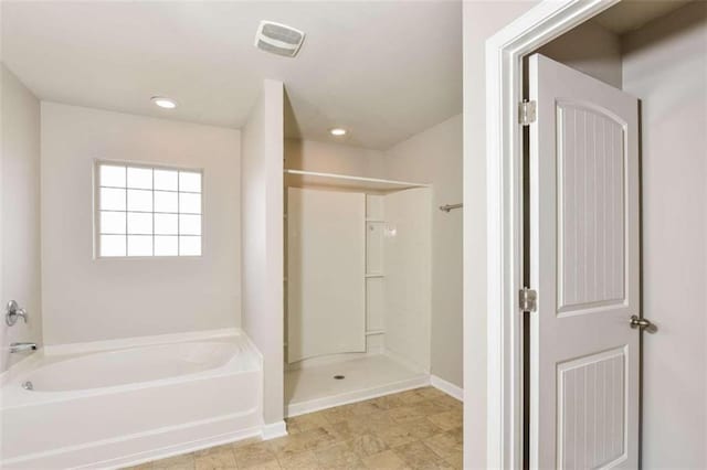 bathroom with shower with separate bathtub