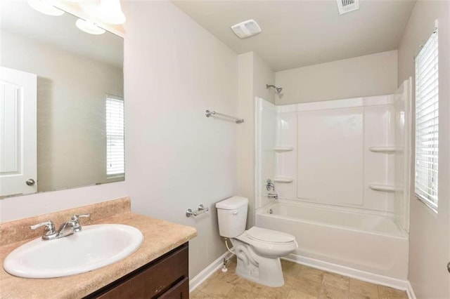 full bathroom with plenty of natural light, toilet, bathing tub / shower combination, and vanity