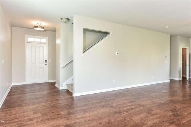 foyer entrance with dark wood-type flooring