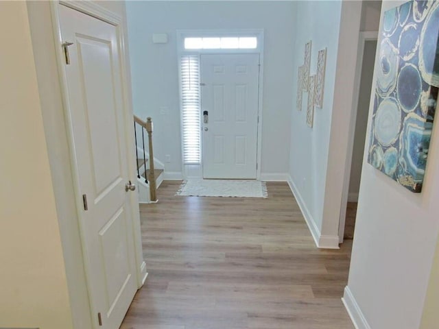 entrance foyer with light hardwood / wood-style flooring