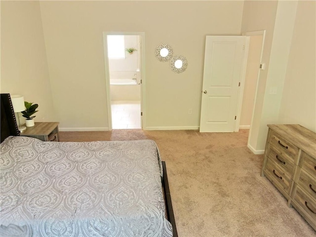 carpeted bedroom featuring connected bathroom