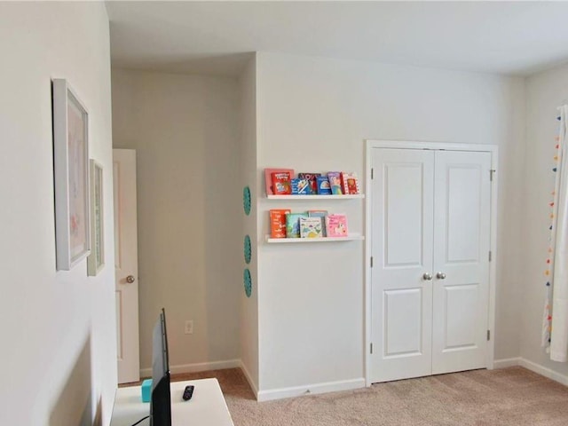 playroom featuring light carpet