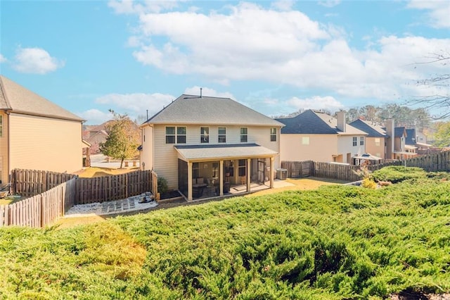 back of house with a sunroom and central AC unit