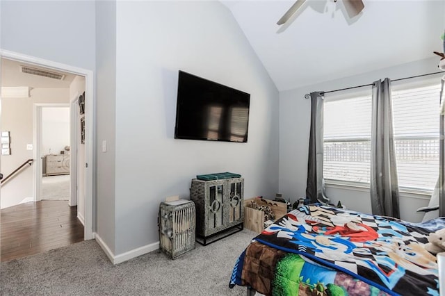 bedroom featuring hardwood / wood-style flooring, ceiling fan, and vaulted ceiling