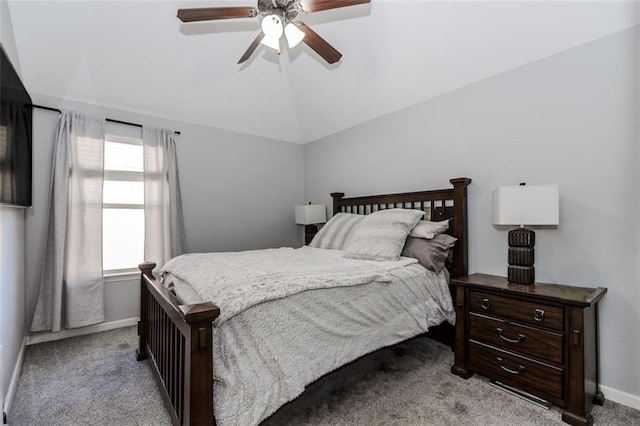 bedroom featuring light colored carpet, vaulted ceiling, and ceiling fan