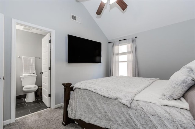 carpeted bedroom featuring ensuite bathroom, ceiling fan, and lofted ceiling