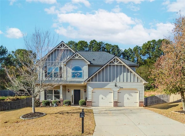 view of front of home featuring a front yard and a garage