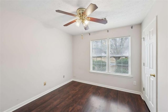 unfurnished room with a ceiling fan, wood finished floors, baseboards, and a textured ceiling