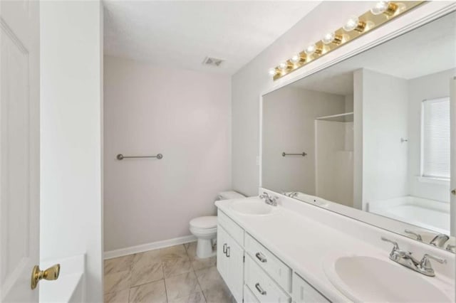 bathroom with visible vents, a garden tub, and a sink