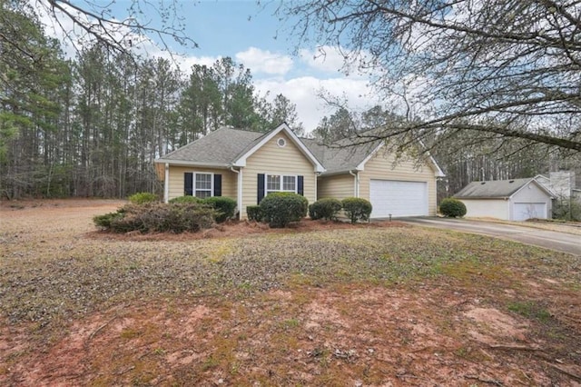 ranch-style house with driveway and an attached garage