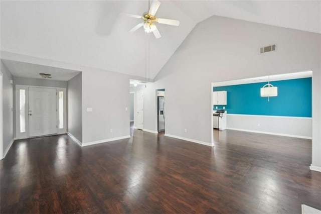 unfurnished living room featuring baseboards, wood finished floors, visible vents, and ceiling fan