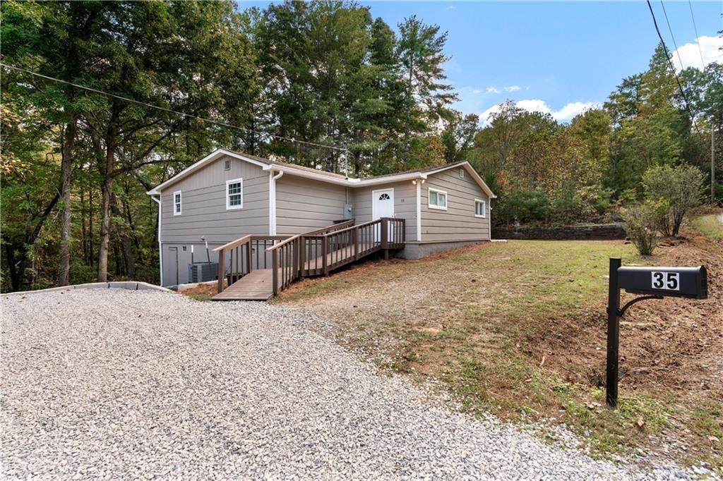 view of side of home with a wooden deck