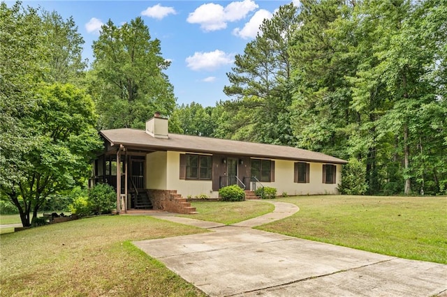 ranch-style house with a front yard