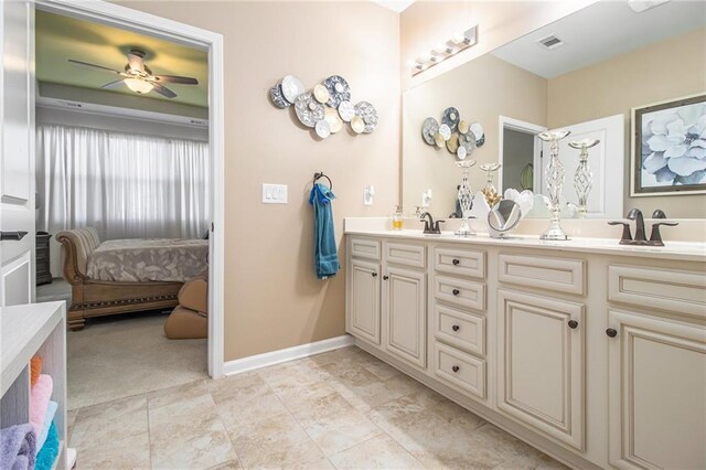 bathroom featuring ceiling fan and vanity