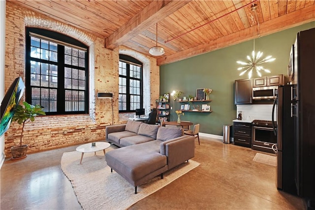 living room featuring wood ceiling, a towering ceiling, beamed ceiling, brick wall, and a notable chandelier