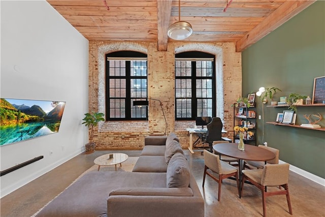 living room featuring wooden ceiling, a towering ceiling, brick wall, french doors, and concrete flooring