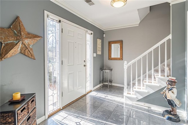 entrance foyer featuring ornamental molding