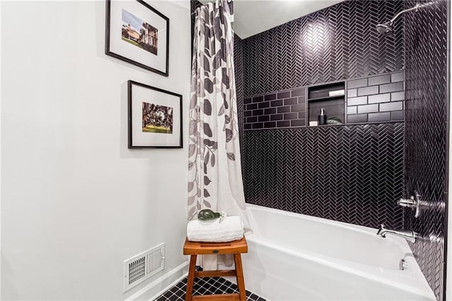 full bathroom featuring shower / bathtub combination with curtain, visible vents, and baseboards