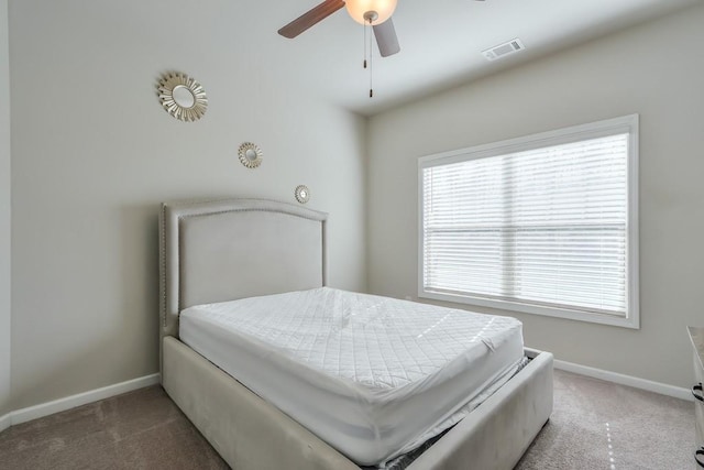 bedroom featuring dark carpet and ceiling fan