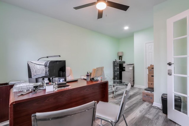 office area with ceiling fan and light hardwood / wood-style floors