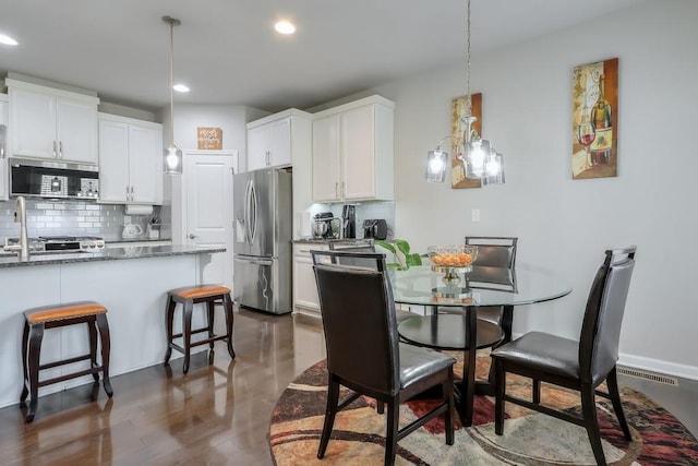 dining space featuring a notable chandelier