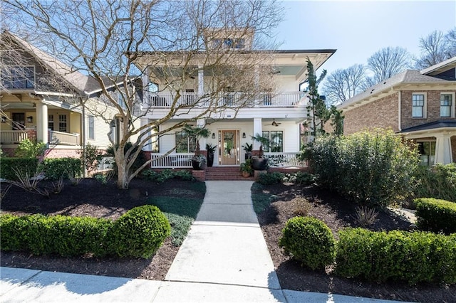 view of front of home featuring a balcony and a porch