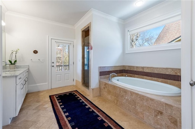 bathroom featuring vanity, ornamental molding, a shower stall, stone finish flooring, and a garden tub