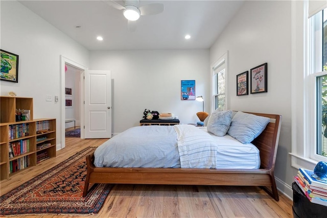 bedroom featuring recessed lighting, wood finished floors, and baseboards